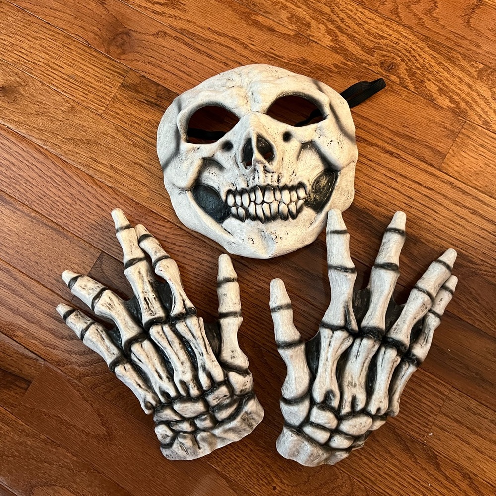 Black hooded cloak with skeleton face and hands